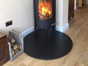 A 20mm Teardrop Hearth in Honed Granite for free standing stove